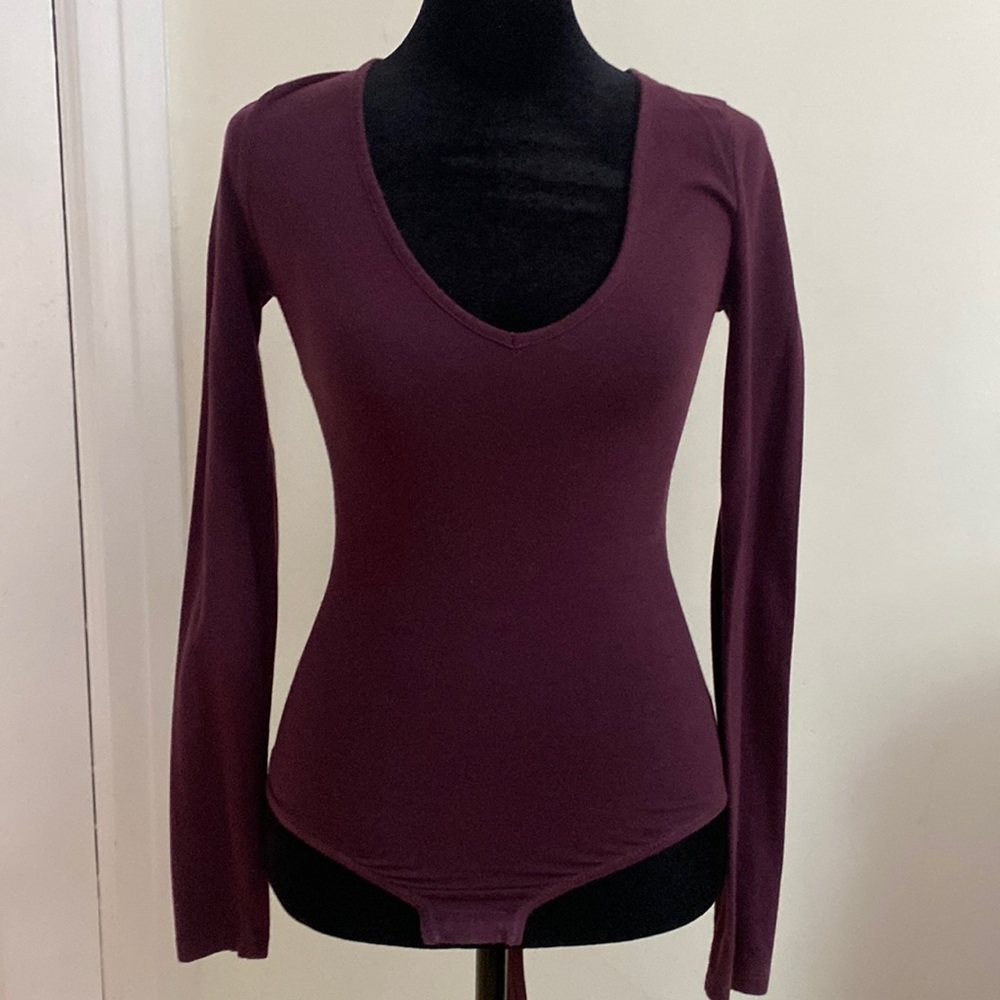 Dark purple long sleeve body suit! Perfect staple in any closet!